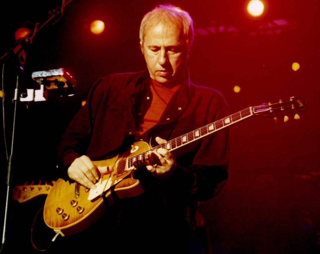 Mark Knopfler in Bilbao playing "Calling Elvis" - photo by aherrero - Flickr - CC BY-2.0 Deed - one of the best classic rock artists of the 70s
